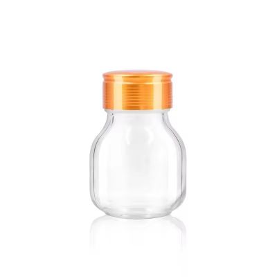 80ml wholesale round shape clear tablet glass bottle with safety seal metal screw lid