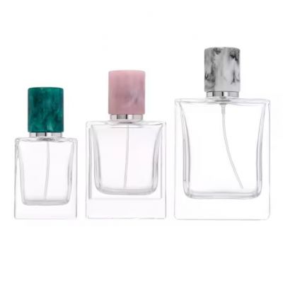 Custom New Design Spray Cap Perfume Bottle 30ml 50ml 100ml Luxury Thick Bottom Glass Bottle With Round Resin Lid