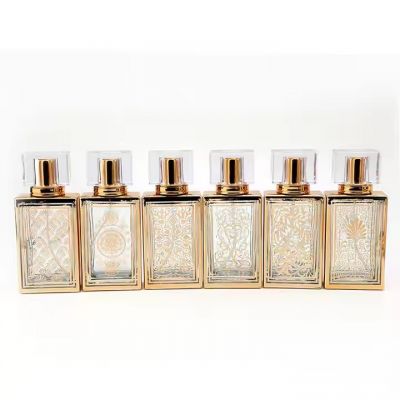 Luxury Electroplating Gold Engraving Logos Glass Perfume Bottles Refillable 50ml Empty Perfume Spray Bottle With Acrylic Lids