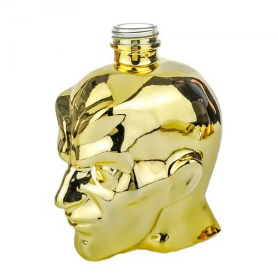 Wholesale 750ml Custom Electroplated Gold Face Shape Liquor Bottle for Whiskey Tequila Vodka Empty Novelty Spirit Glass Bottle