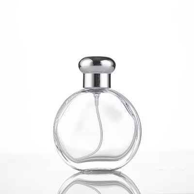 Luxury Flat Shape 50ml 100ml Stock Goods Clear Transparent Premium Glass Perfume Bottle With Sprayer Pump